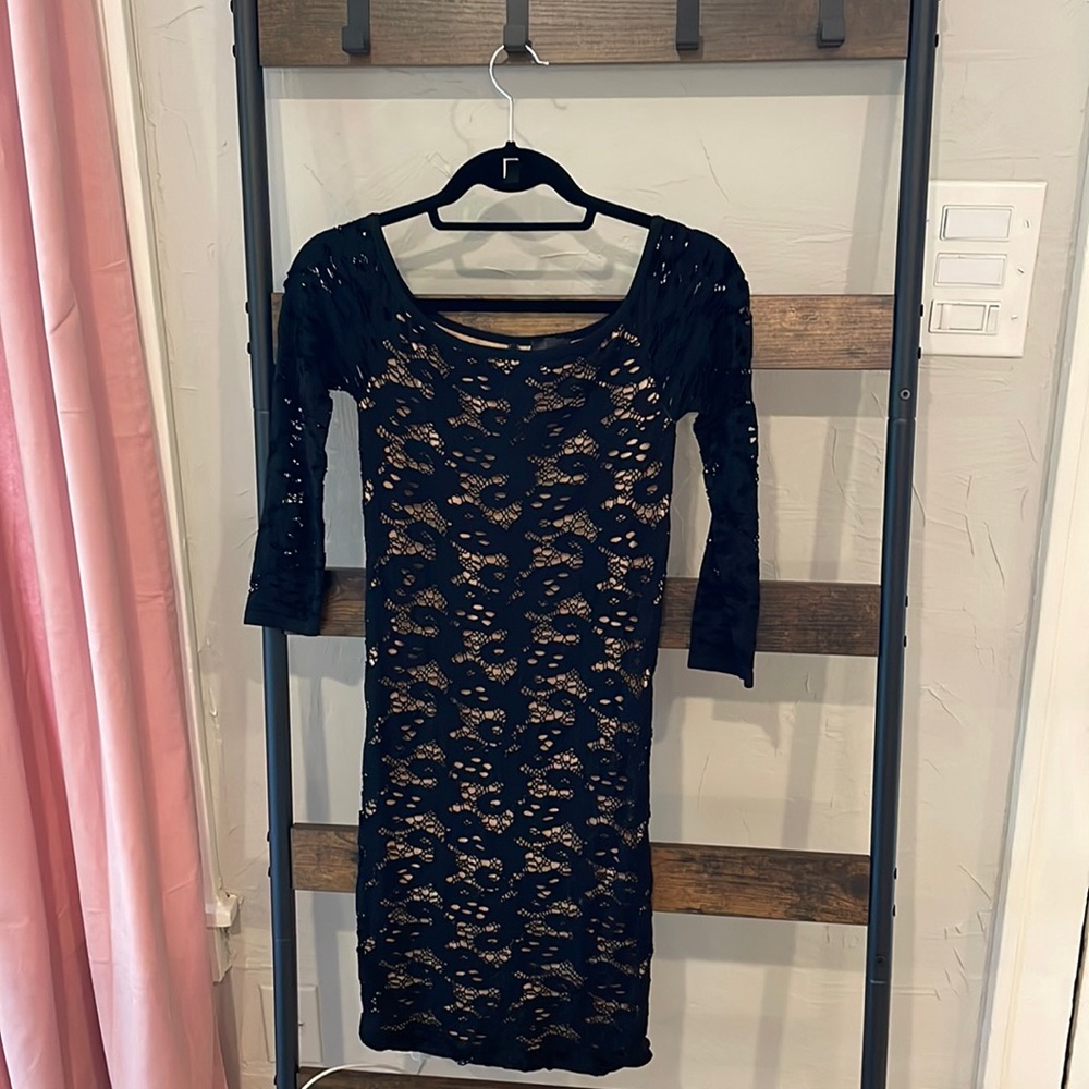 Black stretchy dress with nude layer of material.